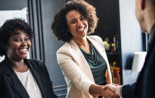 happy handshake improving customer experience